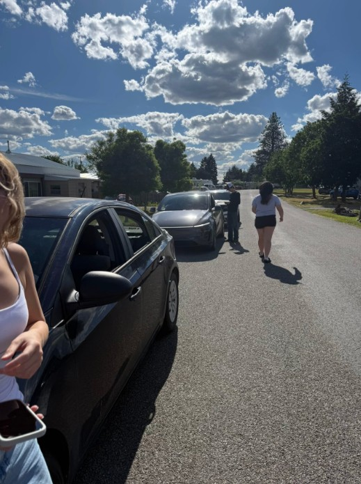 People parked outside of the Gages' property.